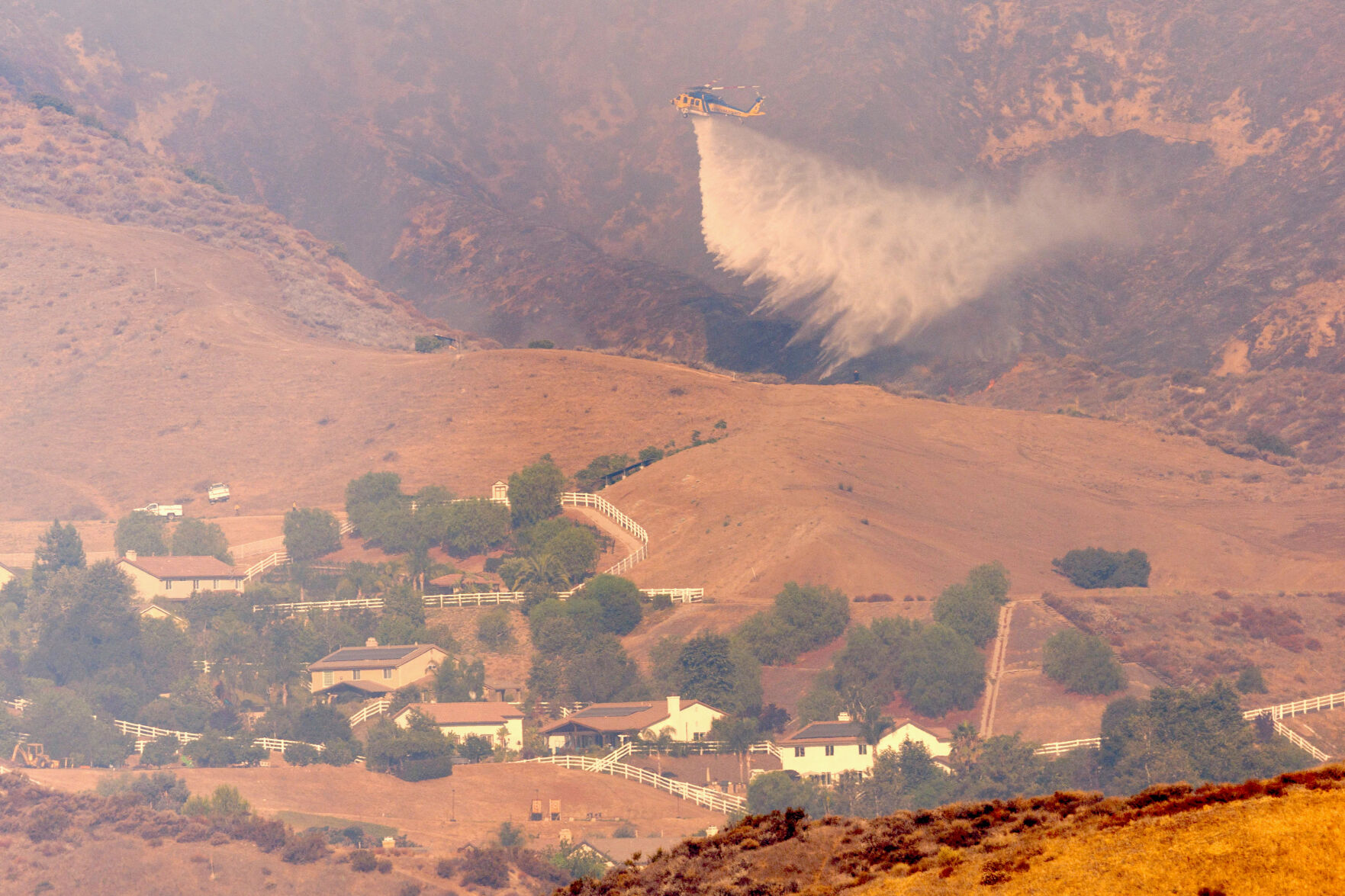 Firefighters make progress against blaze that forced thousands to flee north of Los Angeles